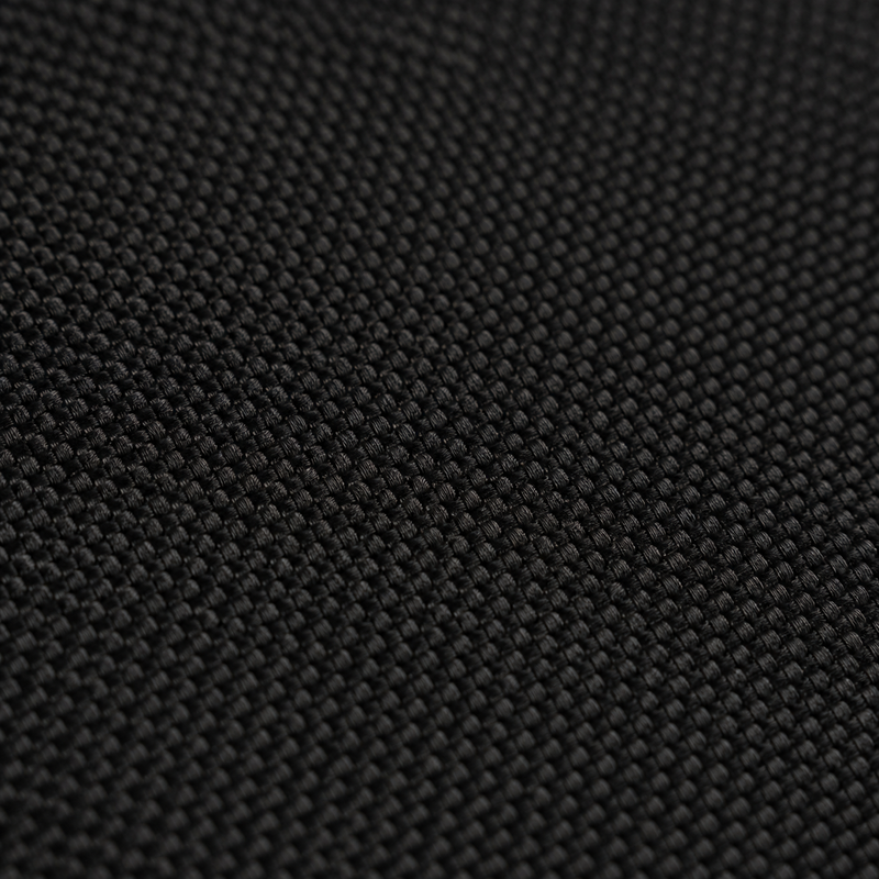 Close-up of the matte fine weave fabric top of the black Difavo Desk Mat