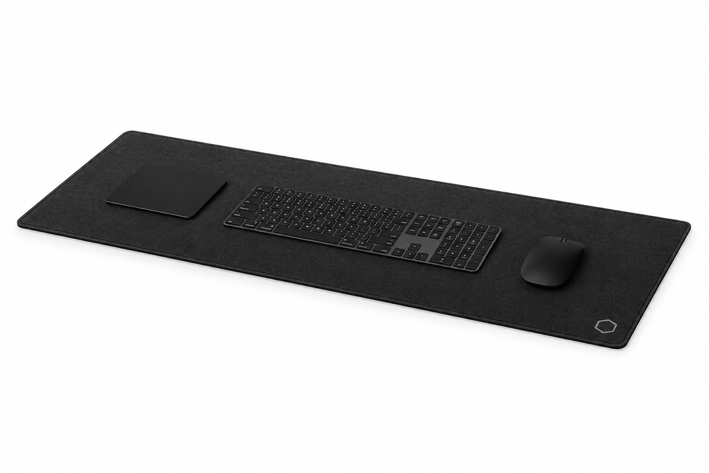 Side profile perspective of the black Difavo desk mat with keyboard, mouse and trackpad, showing its low-profile edge