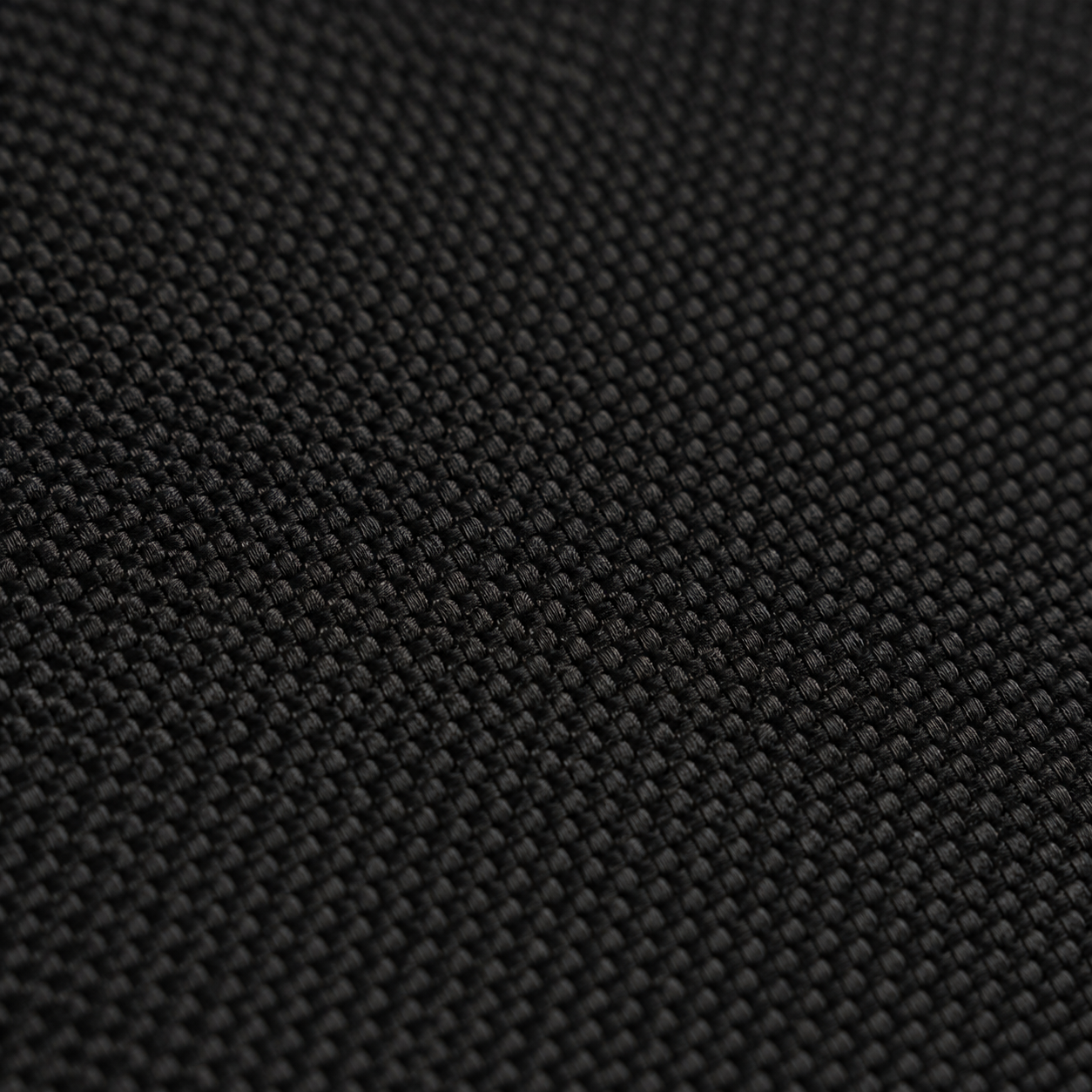 Detail of the matte fine weave fabric surface of the Difavo Desk Mat