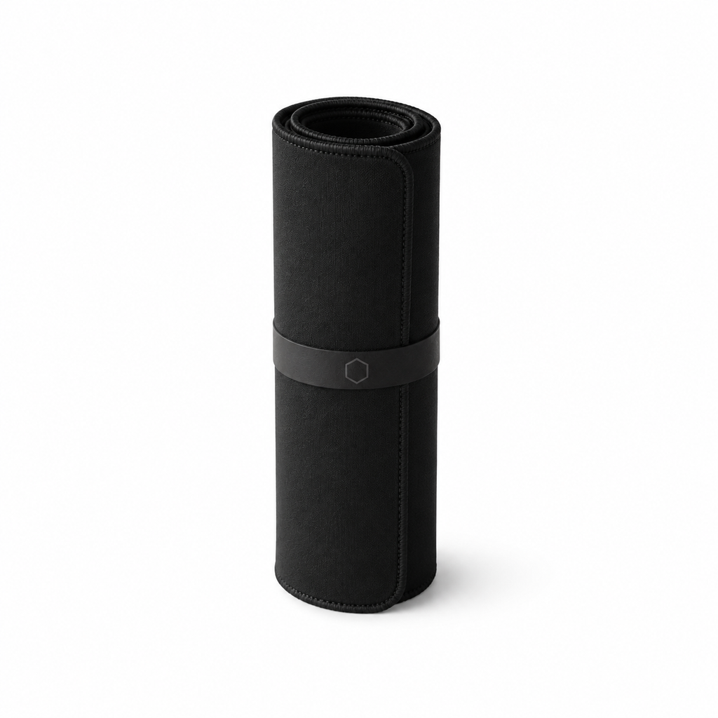 Black Difavo Desk Mat rolled into a neat cylinder, showing how it ships